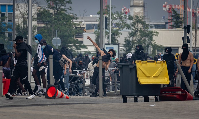 A man throws a stone at security forces during a protest in Nanterre, a town on the western outskirts of Paris, France, on June 29, 2023.(Photo: Xinhua)