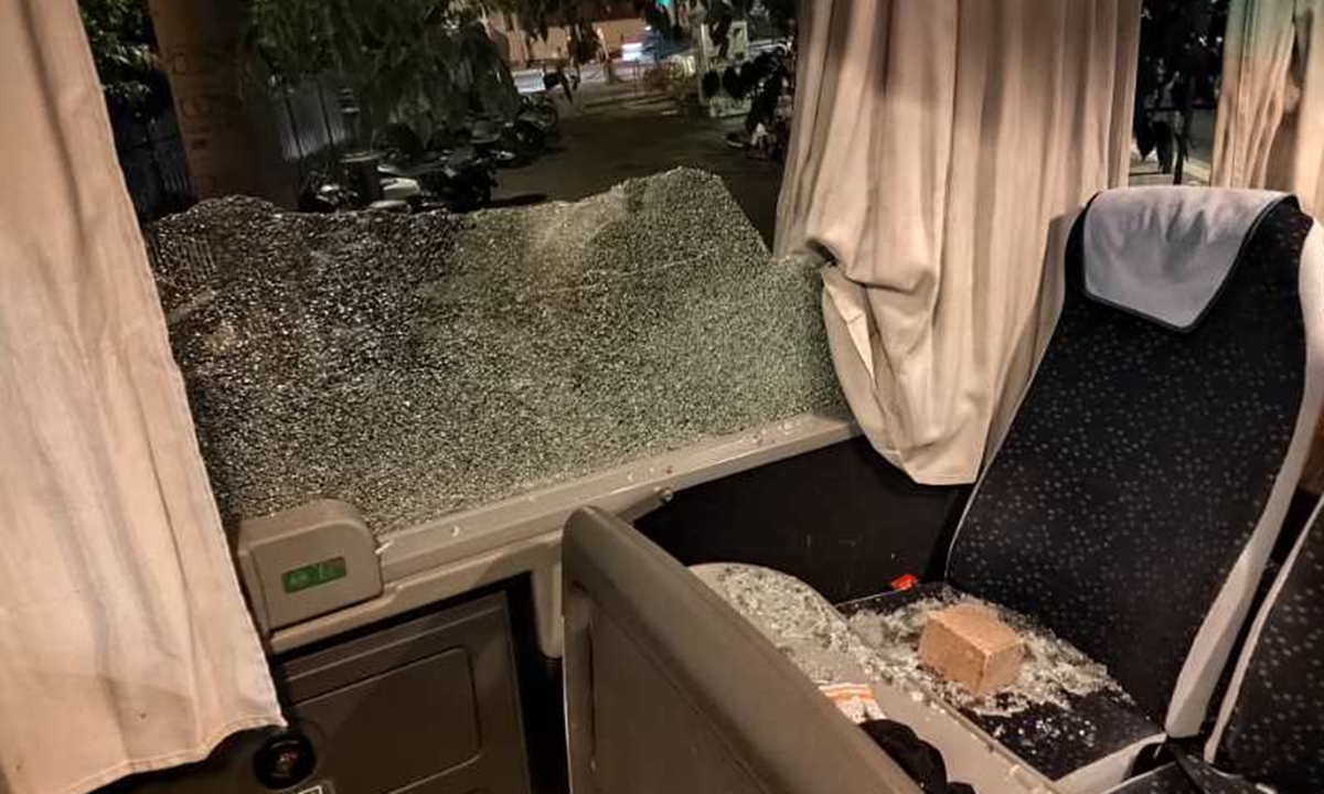 Shards of glass from a tour bus ferrying Chinese tourists are scattered across passenger seats after vandalism by rioters in Marseille, on late June 29, 2023.  Photo: Courtesy of a Chinese tourist surnamed Li