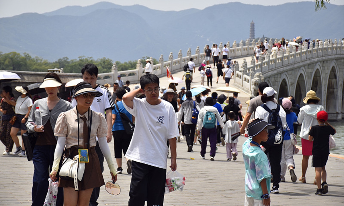 Tourists visit the Summer Palace in Beijing on July 1, 2023. Photo: VCG