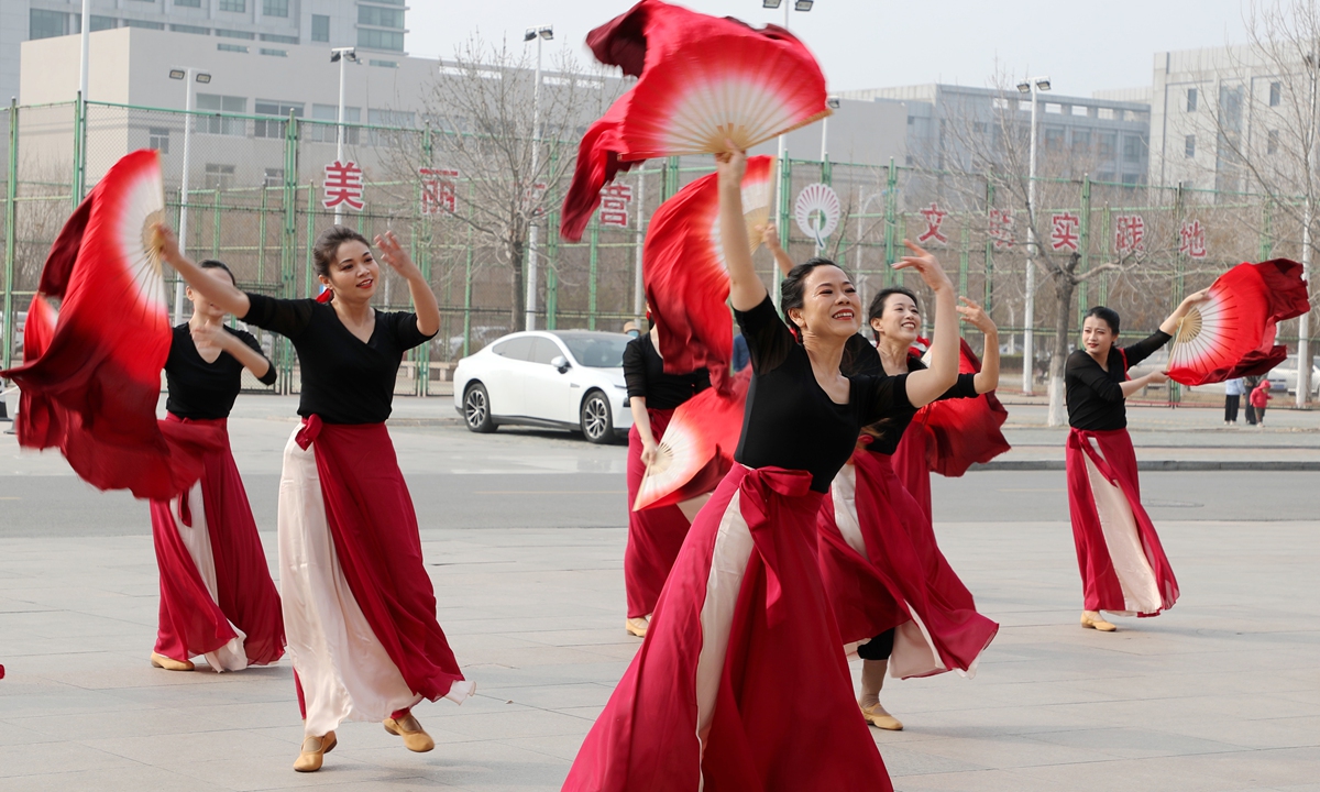 People take part in Chinese square dancing in Dongying, Shandong Province. Photo: VCG