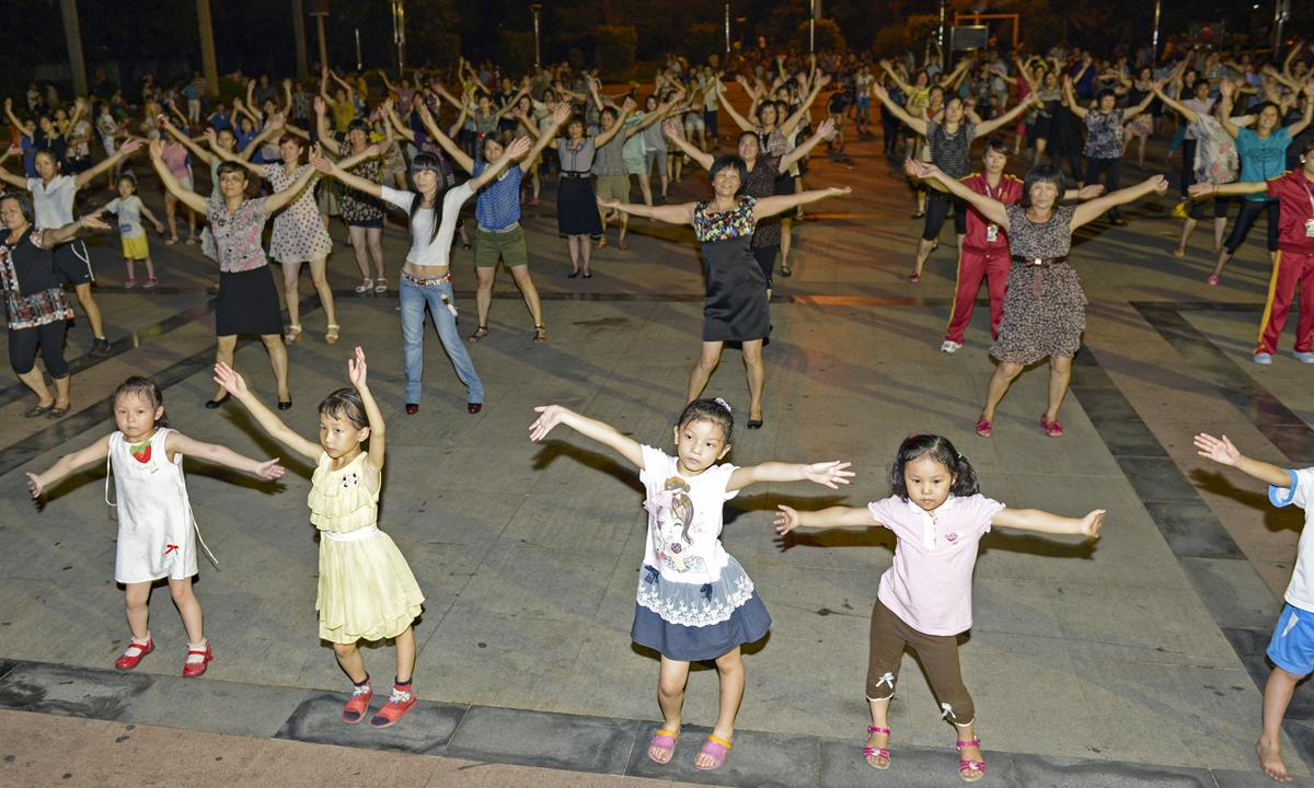 People take part in Chinese square dancing in Dongguan, Guangdong Province. Photo: VCG
