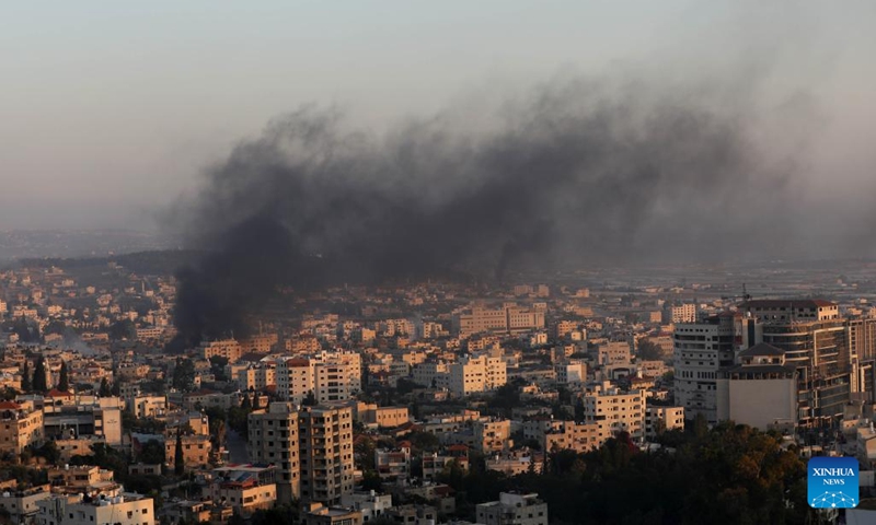 Smoke billows from a refugee camp during an Israeli strike in the West Bank city of Jenin on July 3, 2023. The Israeli army launched a large-scale military strike early on Monday on the northern West Bank city of Jenin, according to eyewitnesses and the Israeli military. (Photo: Xinhua)