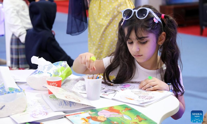 A girl paints during the second edition of the International Festival for Iraqi Children at the Baghdad International Fair in Baghdad, Iraq, on July 2, 2023. The ten-day festival will last till July 3.(Photo: Xinhua)
