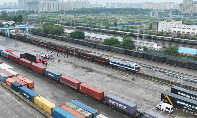 This aerial photo shows the first train of a new international multimodal transport route departing from Langfang City, north China's Hebei Province, July 4, 2023.(Photo: Xinhua)