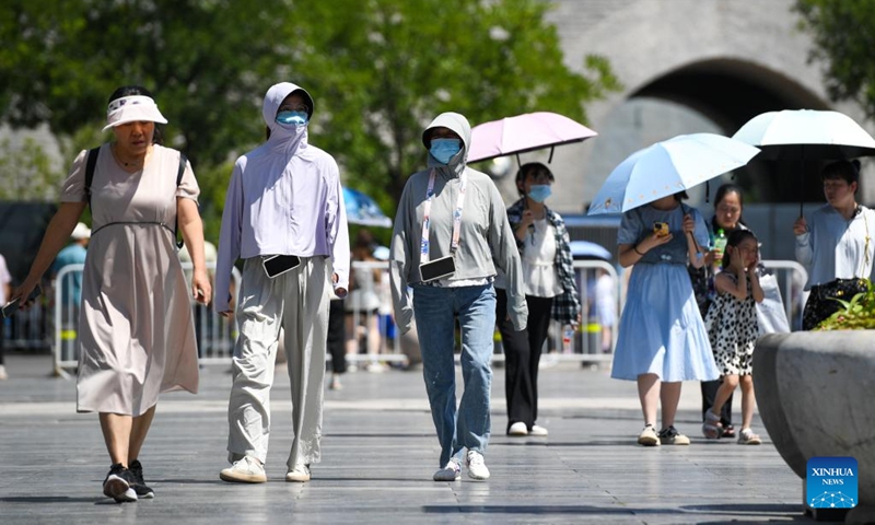 People visit the Qianmen street in Beijing, capital of China, July 6, 2023. Beijing issued a red alert for high temperatures on Thursday, the highest in a color-coded alert system, as temperatures in most parts of the city are expected to rise above 40 degrees Celsius. This is the second red alert for high temperatures issued by the national capital this summer.(Photo: Xinhua)