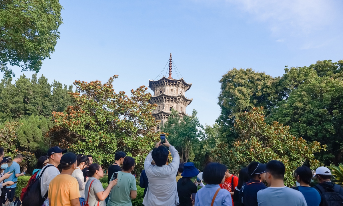 People at the Maritime Silk Road International Documentary Film Festival look at the ancient pagoda at Kaiyuan Temple in Quanzhou, the biggest ancient Buddhist temple in East China's Fujian Province. Photo: Courtesy of organizers
