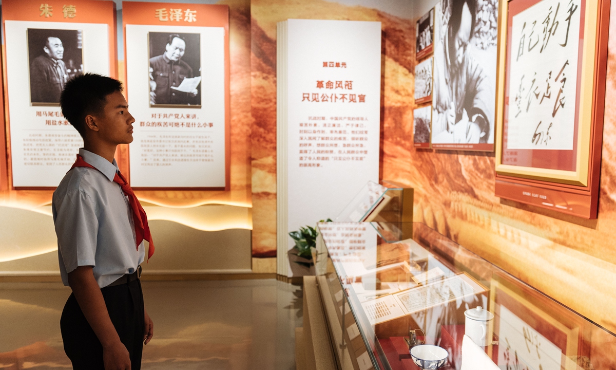A student looks at photos on display at the Museum of the War of the Chinese People's Resistance Against Japanese Aggression in Beijing, on July 7, 2023. A special exhibition is being held at the museum to commemorate the 86th anniversary of the July 7 Incident, which marked the beginning of Japan's full-scale invasion of China, and China's whole-nation resistance against the Japanese invaders. Photos: Li Hao/GT