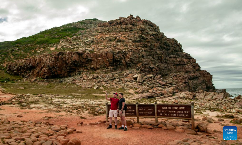 Tourists pose for photos at the Cape of Good Hope in Cape Town, South Africa, Feb. 15, 2023. (Xinhua/Zhang Yudong)