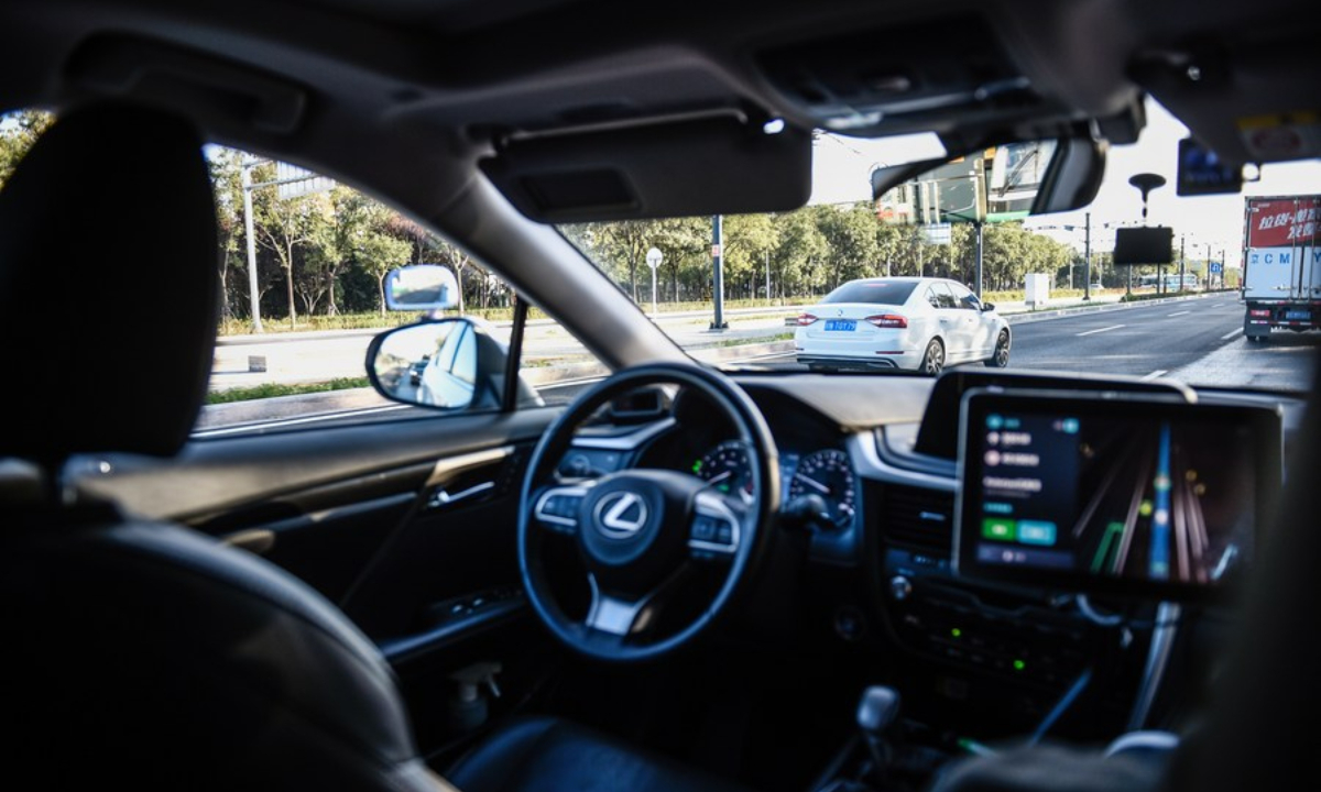 An autonomous vehicle is in driverless test on a road in Yizhuang of Beijing, capital of China, Oct 19, 2021. Photo:Xinhua