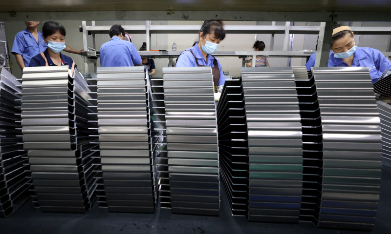 Workers produce precision components for new-energy batteries at a factory in Ningde, East China's Fujian Province, on July 20, 2023. Green industries are new growth forces in the national economy. In the first half of 2023, China's exports of electric vehicles, lithium-ion batteries and solar cells increased by 61.6 percent year-on-year, driving overall export growth of 1.8 percentage points. Photo: cnsphoto