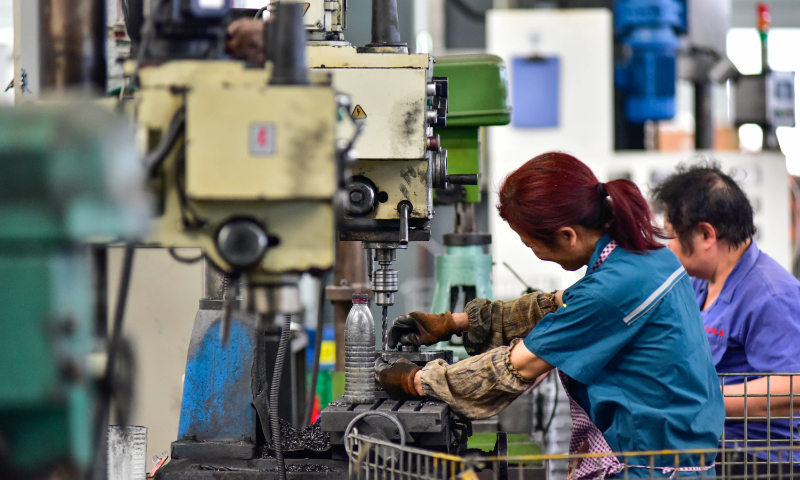 Workers process products at a workshop in Weifang, East China's Shandong Province, on June 9, 2023. Photo: VCG