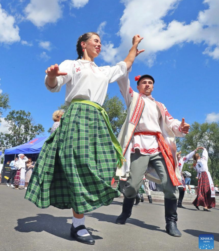 People dance during a folk dance competition in Vitebsk, Belarus, July 15, 2023. A folk dance competition was held here during the 32nd International Festival of Arts Slavianski Bazaar. (Photo by Henadz Zhinkov/Xinhua)