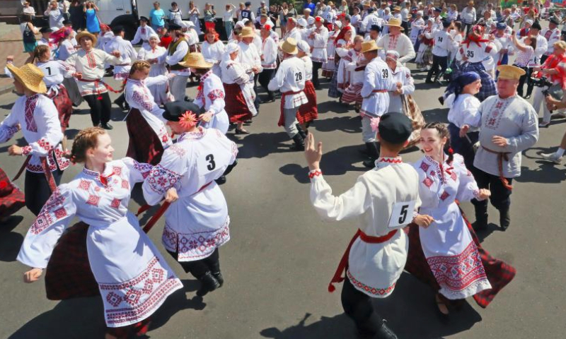 People dance during a folk dance competition in Vitebsk, Belarus, July 15, 2023. A folk dance competition was held here during the 32nd International Festival of Arts Slavianski Bazaar. (Photo by Henadz Zhinkov/Xinhua)