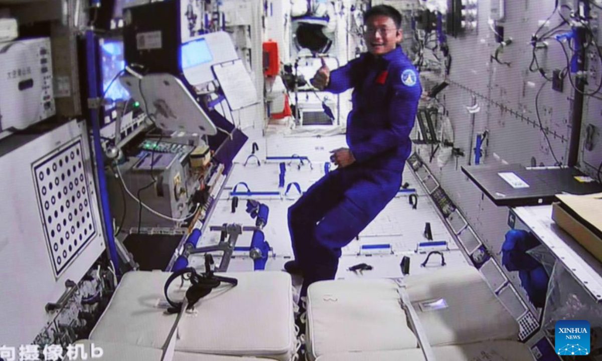 This screen image captured at Beijing Aerospace Control Center on July 20, 2023 shows Shenzhou-16 astronaut Gui Haichao giving a thumb-up for his crewmates Jing Haipeng and Zhu Yangzhu upon completion of the spacewalk. Photo:Xinhua