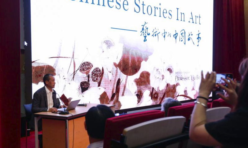 Professor Liu Bo from Chinese National Academy of Arts makes a presentation on Chinese Stories in Art at the China Cultural Center in Brussels, Belgium, July 14, 2023. A Chinese and European cultural dialogue was held here on Friday. (Xinhua/Zheng Huansong)