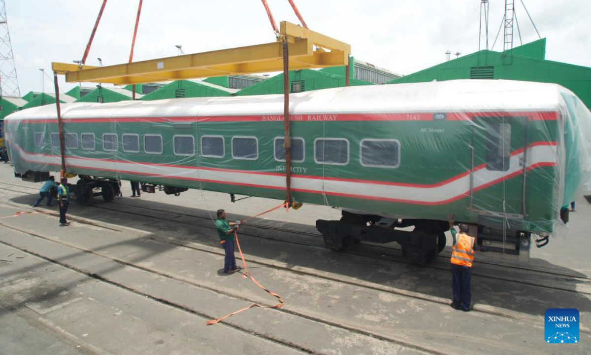 This photo taken on July 11, 2023 shows a broad-gauge carriage imported from China unloaded in Chittagong city, Bangladesh. With the last 20 broad-gauge carriages imported from China successfully arriving and unloaded in Chittagong city on Tuesday, 100 broad-gauge carriages for the Padma Bridge Rail Link Project have now reached Bangladesh, marking the successful delivery of the first single project of this largest railway project in the South Asian country. Photo:Xinhua