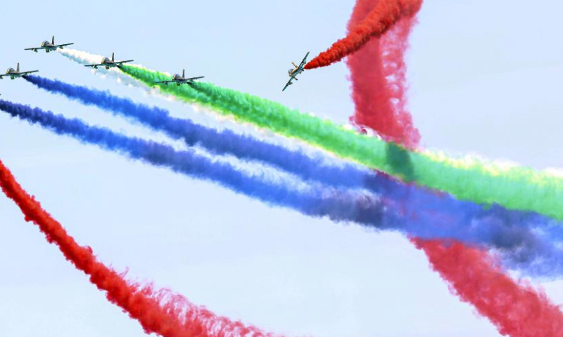 Aircrafts perform aerobatics during the El-Alamein Air Show 2023 in the New Alamein City, Egypt, July 23, 2023. Aircrafts from Egypt and the United Arab Emirates (UAE) on Sunday jointly staged the El-Alamein Air Show 2023 at the Mediterranean coastal city of New Alamein. (Xinhua/Ahmed Gomaa)