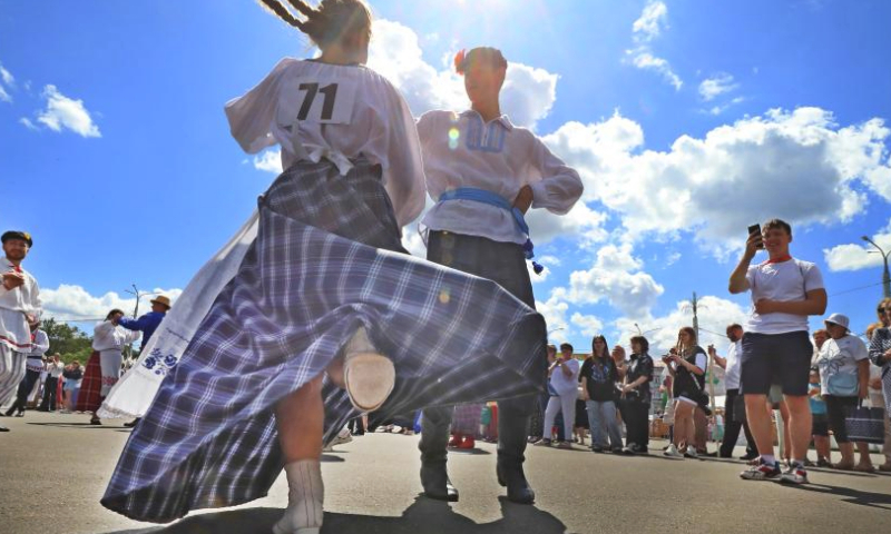 People dance during a folk dance competition in Vitebsk, Belarus, July 15, 2023. A folk dance competition was held here during the 32nd International Festival of Arts Slavianski Bazaar. (Photo by Henadz Zhinkov/Xinhua)