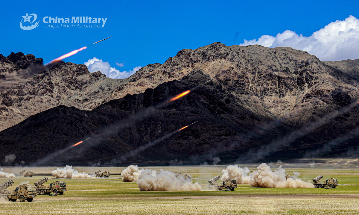 Vehicle-mounted rocket launchers attached to an artillery element of a regiment under the PLA Xinjiang Military Command fire at mock targets during a live-fire training exercise in early July, 2023. Photo: China Military
