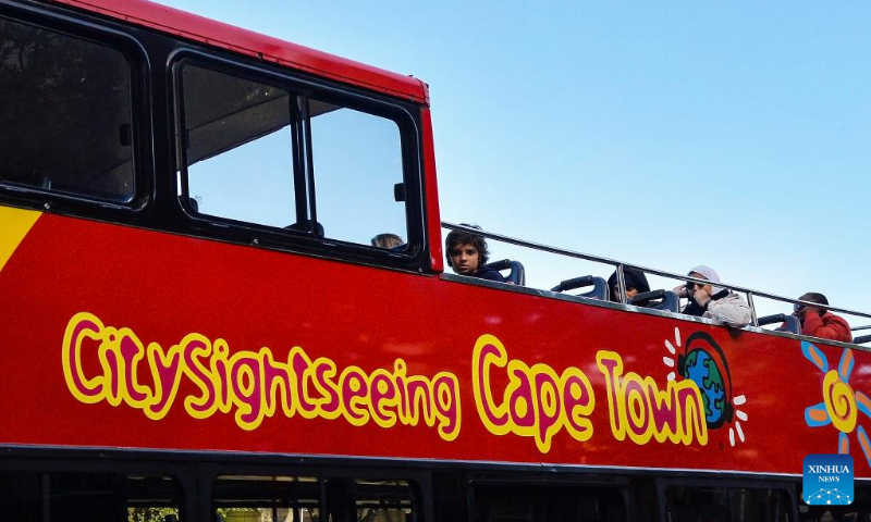 Tourists are seen on a sightseeing bus in Cape Town, South Africa, July 17, 2023. (Photo by Xabiso Mkhabela/Xinhua)