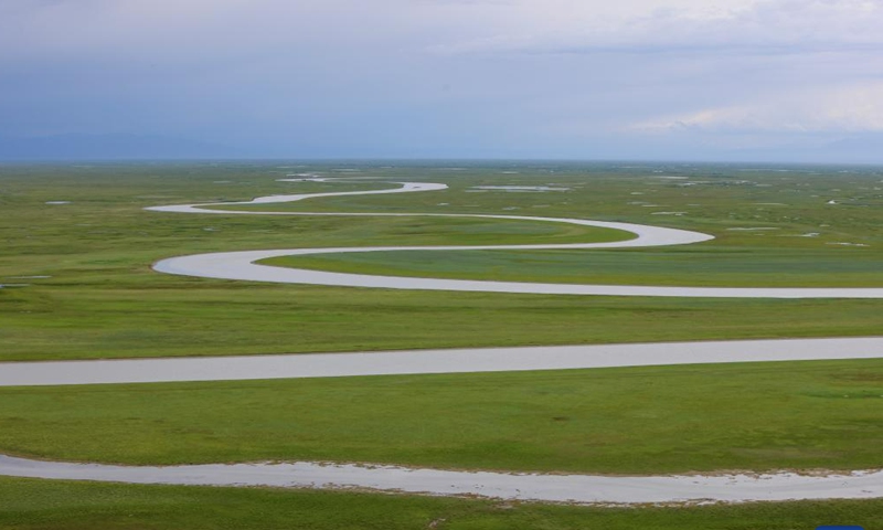 This photo taken on July 6, 2023 shows a view of the Bayan Bulag grassland in Hejing County, Bayingolin Mongolian Autonomous Prefecture, northwest China's Xinjiang Uygur Autonomous Region. Midsummer is one of the best time of year to visit the Bayan Bulag grassland in Hejing County. (Xinhua/Hao Zhao)