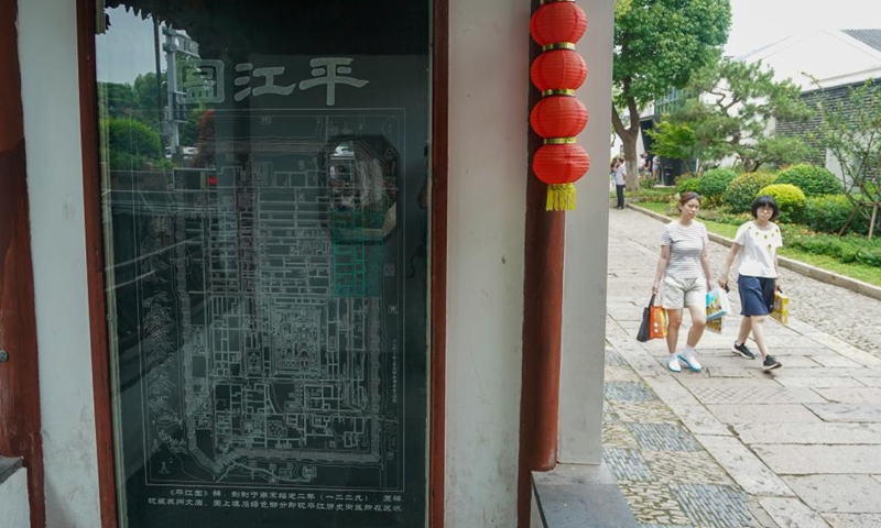 People visit a historic and cultural block of Pingjiang Road in Suzhou, east China's Jiangsu Province, July 6, 2023. (Xinhua/Li Bo)