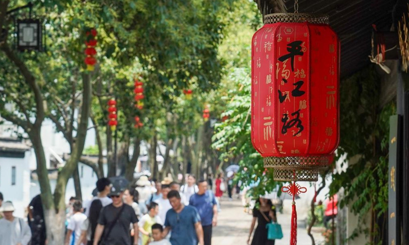 People visit a historic and cultural block of Pingjiang Road in Suzhou, east China's Jiangsu Province, July 6, 2023. (Xinhua/Li Bo)
