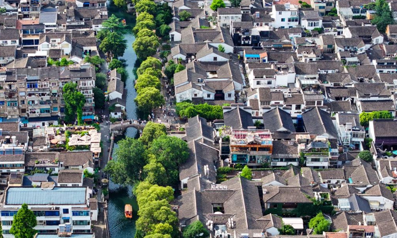 This aerial photo taken on July 3, 2023 shows a view of a historic and cultural block of Pingjiang Road in Suzhou, east China's Jiangsu Province. (Xinhua/Li Bo)