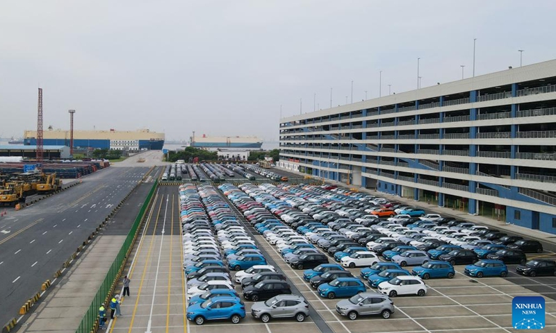 This aerial photo taken on July 9, 2023 shows MG cars produced by Shanghai Automotive Industry Corp (SAIC) to be shipped to Australia at Shanghai Haitong International Automotive Terminal in Waigaoqiao of east China's Shanghai. The Waigaoqiao Haitong pier is one of China's largest auto-export terminals. (Xinhua/Fang Zhe)