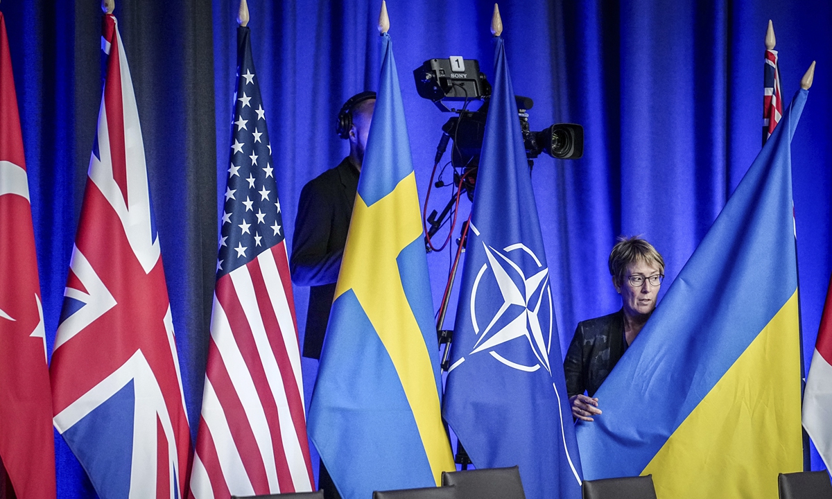 
The flag of Ukraine is half-raised into position at the beginning of the NATO-Ukraine meeting at the NATO Summit on July 12, 2013 in Vilnius, Lithuania. Ukrainian President Volodymyr Zelensky jolted the summit of NATO leaders by blasting their joint statement on his country's prospective membership, decrying its lack of a concrete timeline as 