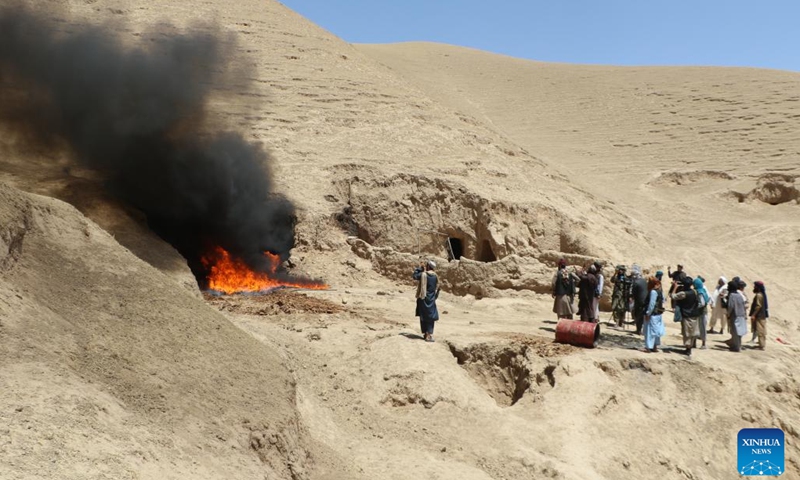 Afghan security personnel burn down drug processing facilities in Jawzjan province, Afghanistan, July 10, 2023. Police have discovered and destroyed a drug processing lab and arrested its owner in north Afghanistan's Jawzjan province, Mohammad Younus Akhundzada, the provincial director for counter-narcotics police, said Wednesday(Photo: Xinhua)