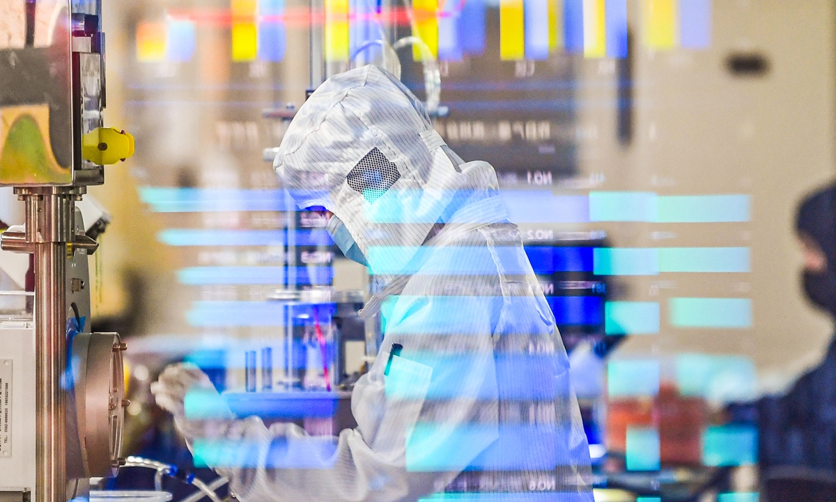 A worker tests semiconductor chips in a factory in Yancheng, East China's Jiangsu Province, on April 14, 2023. Photo: VCG