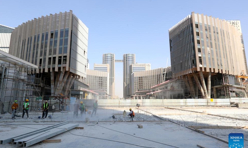 Laborers work at the construction site of the Central Business District (CBD) project in the new administrative capital, east of Cairo, Egypt, July 24, 2023. (Xinhua/Sui Xiankai)