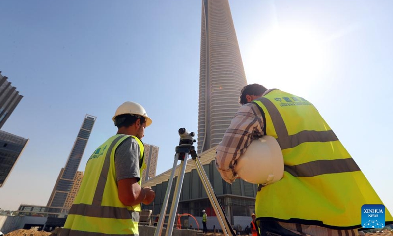 Laborers work at the construction site of the Central Business District (CBD) project in the new administrative capital, east of Cairo, Egypt, July 24, 2023. (Xinhua/Sui Xiankai)
