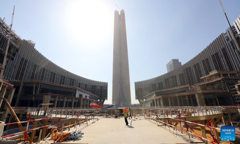 Laborers work at the construction site of the Central Business District (CBD) project in the new administrative capital, east of Cairo, Egypt, July 24, 2023. (Xinhua/Sui Xiankai)