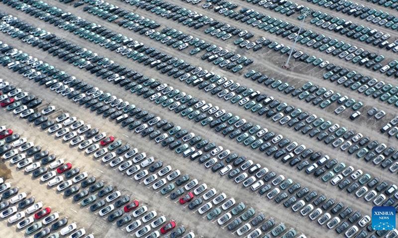 This aerial photo taken on July 20, 2023 shows a vehicle distribution center of Chang'an Auto in Jiangbei District, southwest China's Chongqing Municipality. In recent years, Chongqing Municipality has accelerated the building of new energy vehicle (NEV) industrial clusters. At present, production lines of NEV industry in Chongqing are operating at full swing to meet the domestic and international market demand. (Xinhua/Tang Yi)