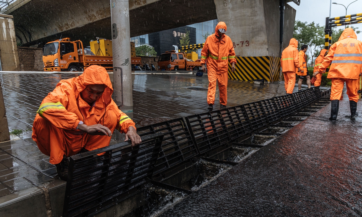 Emergency response personnel stand ready at an underpass prone to waterlogging in Shijiangshan district in southwestern Beijing to prepare for emergencies on July 30, 2023 as the metropolis has posted a highest-level red alert for heavy rainstorms brought by the remnants of Typhoon Doksuri. Beijing authorities have been in full preparations for the heavy rainstorms that have swept across the city. Photo: Li Hao/GT