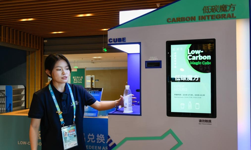Staff member shows an innovative recycling box known as the magic cube in the Universiade Village, Chengdu, southwest China's Sichuan Province, July 16, 2023. Photo: Xinhua