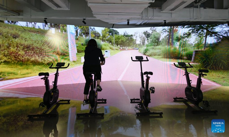 A woman experiences a recreational facility at the Main Media Center for the Chengdu Universiade, in Chengdu, capital of southwest China's Sichuan Province, on July 14, 2023. The Main Media Center (MMC) for the 31st FISU Summer World University Games in Chengdu located near the Dong'an Lake Sports Park where the Games' opening ceremony will take place.Photo: Xinhua