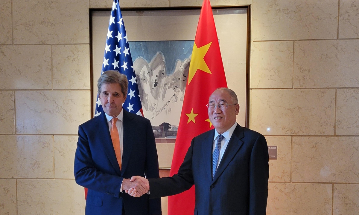 Xie Zhenhua, China's special envoy for climate change, shakes hands with visiting US climate envoy John Kerry ahead of their talks in Beijing on July 17, 2023. Photo: VCG

