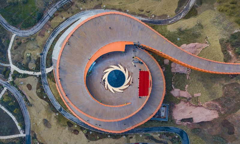 This aerial photo taken on Dec. 31, 2019 shows the Sun and Immortal Birds Gold Ornament on an observation deck of Longquanshan Forest Park in Chengdu of southwest China's Sichuan Province. Photo: Xinhua