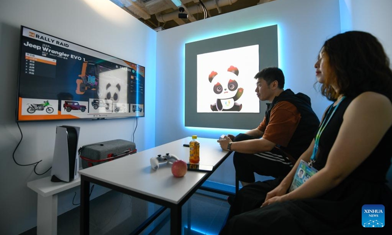 People experience a recreational facility at the Main Media Center for the Chengdu Universiade, in Chengdu, capital of southwest China's Sichuan Province, on July 14, 2023. The Main Media Center (MMC) for the 31st FISU Summer World University Games in Chengdu located near the Dong'an Lake Sports Park where the Games' opening ceremony will take place. The MMC includes the Main Press Center (MPC) and International Broadcasting Center (IBC) and will be fully operational as of July 25. (Xinhua/Xu Bingjie)
