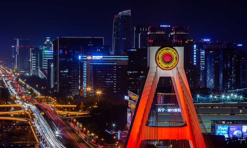 The Sun and Immortal Birds Gold Ornament is seen on a bridge in Chengdu of southwest China's Sichuan Province. Photo: Xinhua