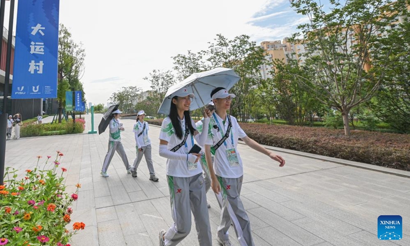 Volunteers walk in the Universiade Village, Chengdu, southwest China's Sichuan Province, July 15, 2023. Photo: Xinhua