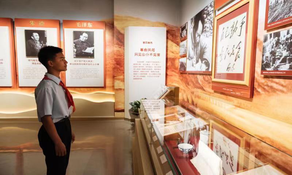 A student looks at photos on display at the Museum of the War of the Chinese People's Resistance Against Japanese Aggression in Beijing, on July 7, 2023. A special exhibition is being held at the museum to commemorate the 86th anniversary of the July 7 Incident, which marked the beginning of Japan's full-scale invasion of China, and China's whole-nation resistance against the Japanese invaders. Photos: Li Hao/GT