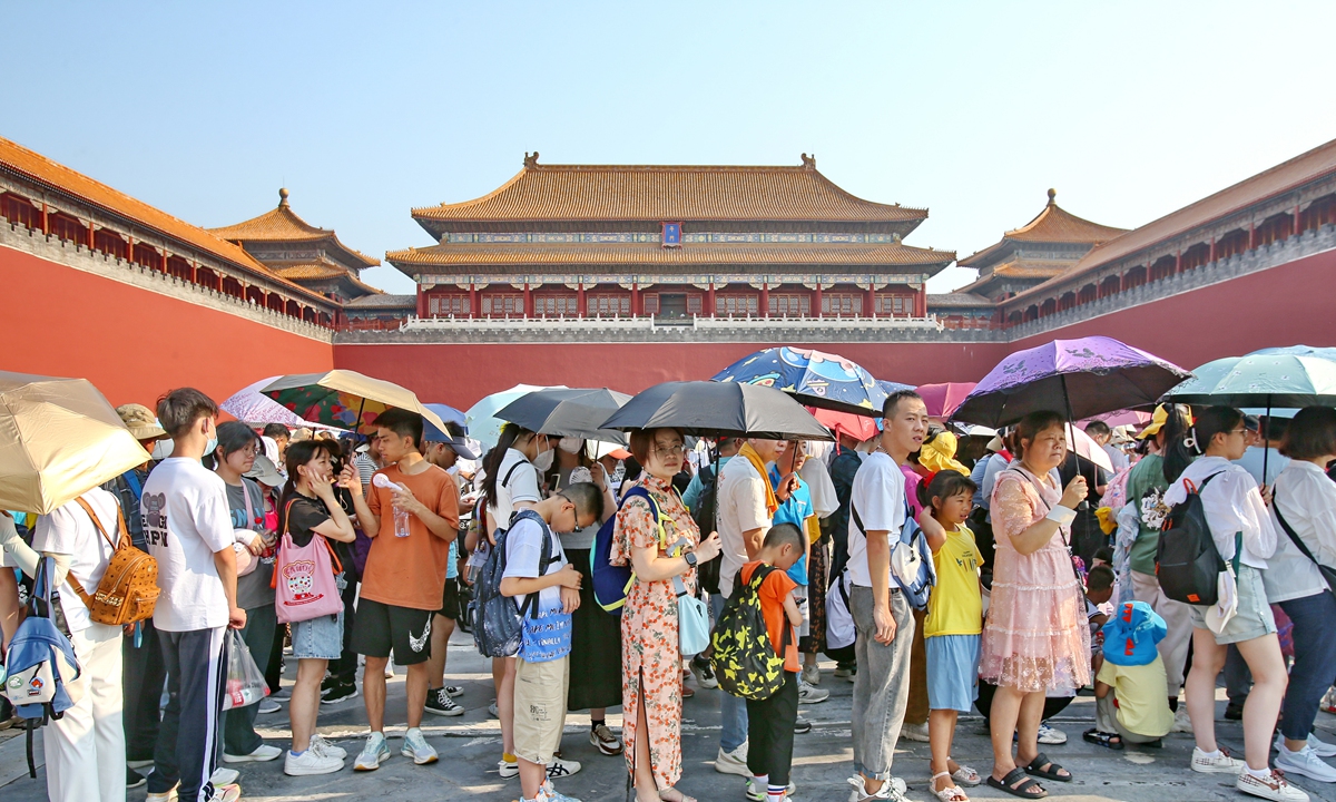Tourists queue up as they visit the Palace Museum in Beijing on July 18, 2023. In response to the surge in tourists during the summer vacation period, the Palace Museum recently issued a notice asking travel agencies and visitors to avoid peak times and make reasonable arrangements for visits. Photo: IC