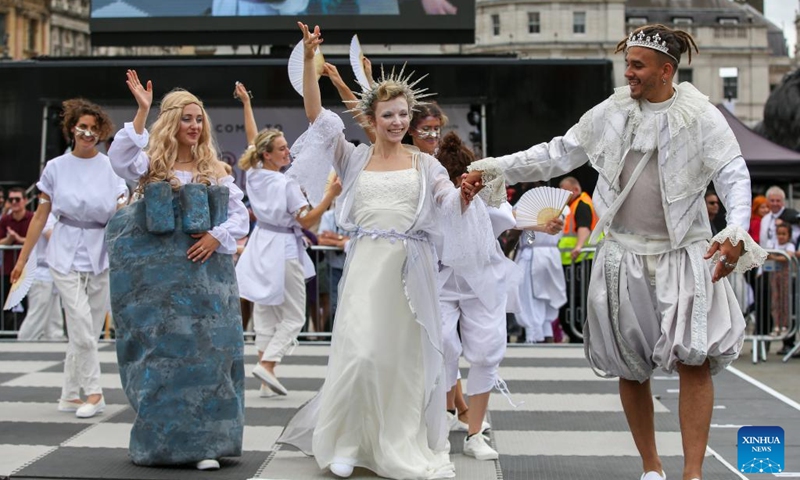 Actors dressed in chess pieces perform in a living chess display during the ChessFest at the Trafalgar Square in London, Britain, July 16, 2023. ChessFest, an annual open-air chess festival in Britain, took place in London on Sunday.(Photo: Xinhua)
