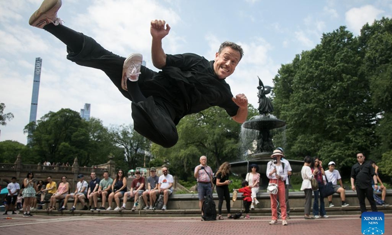 A martial artist performs during a dragon eye dotting ceremony of Hong Kong Dragon Boat Festival in Central Park in New York, the United States, on July 20, 2023. A dragon eye dotting ceremony was held in New York City, the United States, on Thursday as a prelude to the 2023 Hong Kong Dragon Boat Festival, which is scheduled for next month.(Photo: Xinhua)