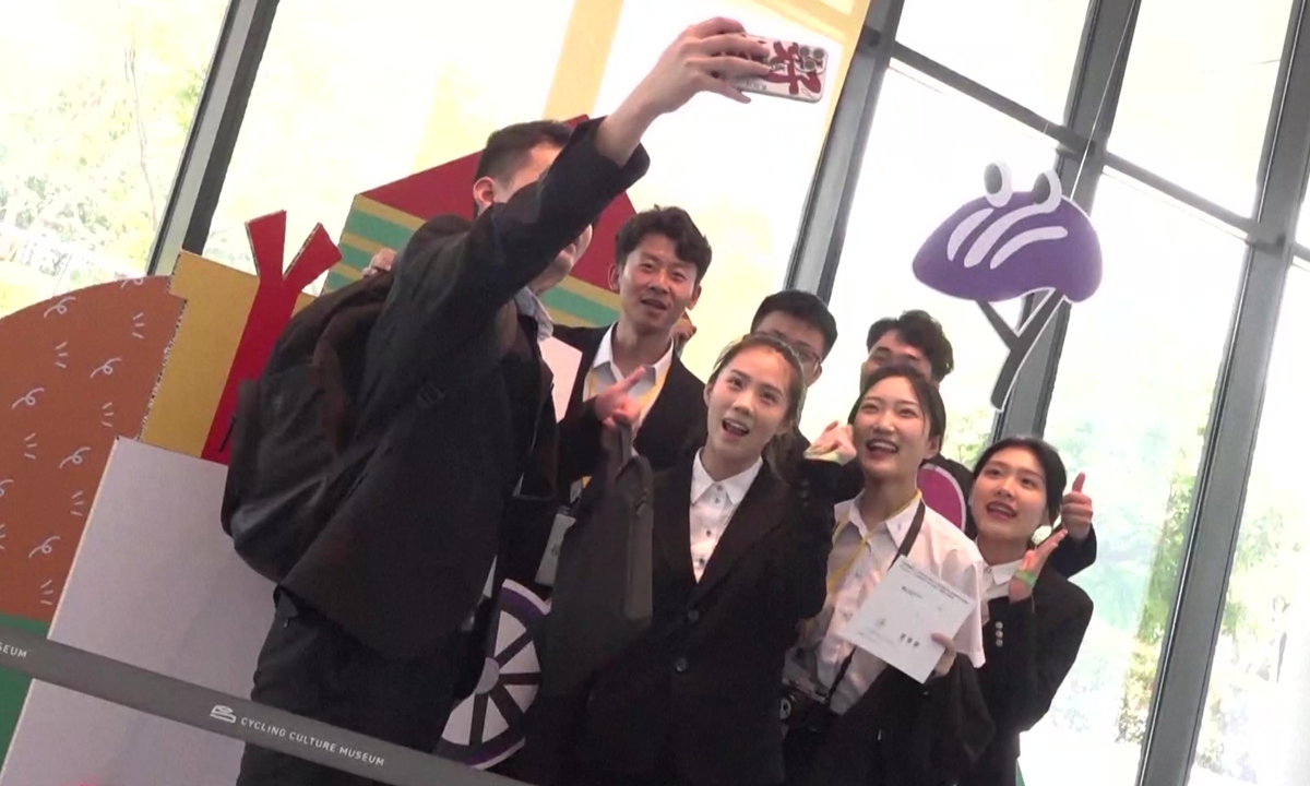 Chinese mainland university students on a visit to the island of Taiwan pose for a group photo on July 16, 2023. 