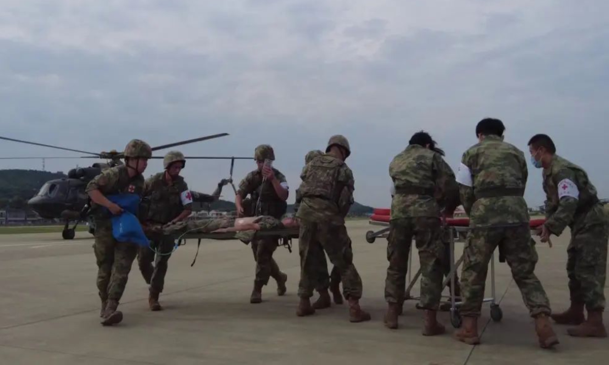 A helicopter transfers mock wounded personnel from a frontier island to the mainland in a land-air integrated medical evacuation exercise organized by the PLA Eastern Theater Command in the summer of 2023. Photo: Screenshot from CCTV